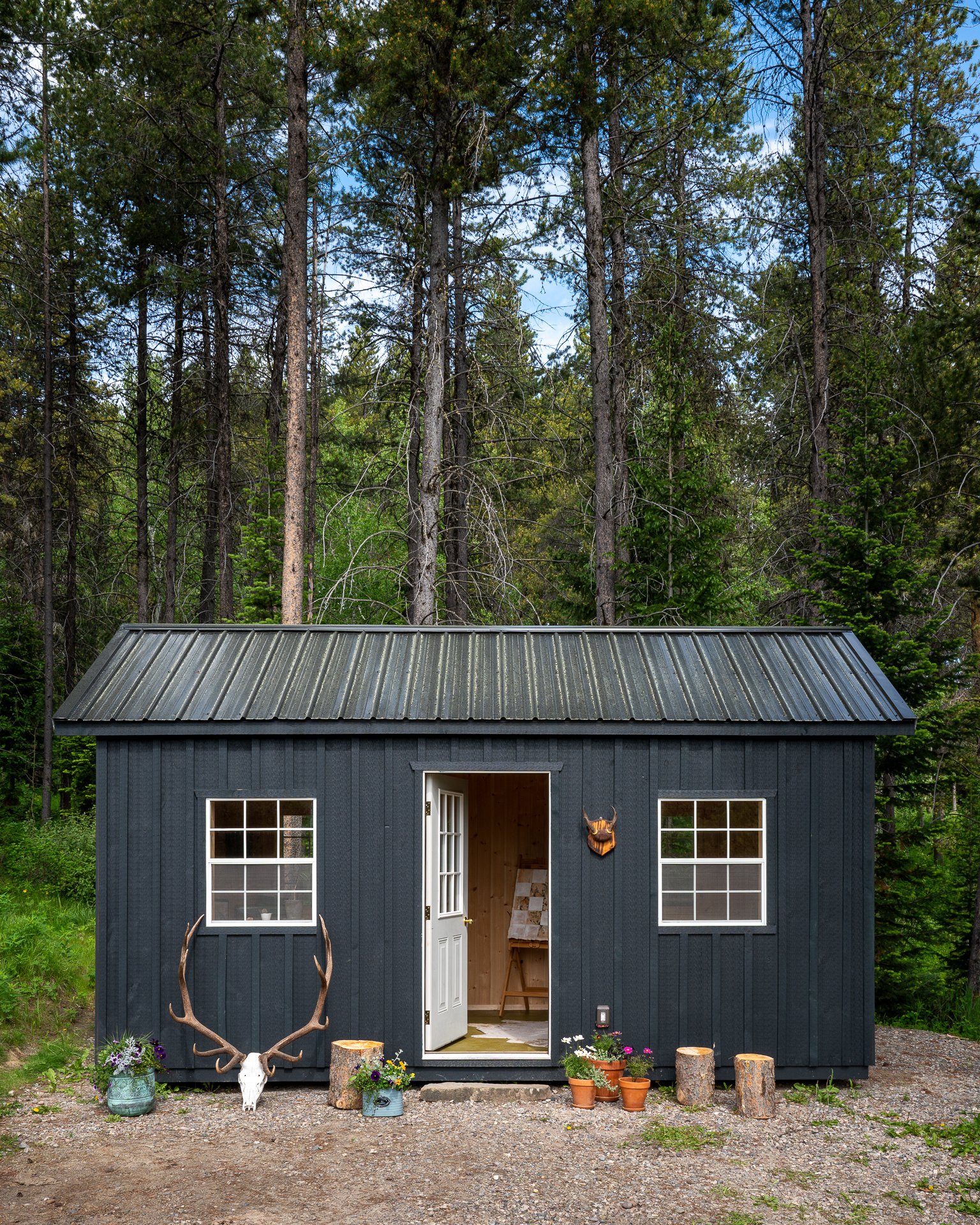 Storage shed with metal roof converted into outdoor office